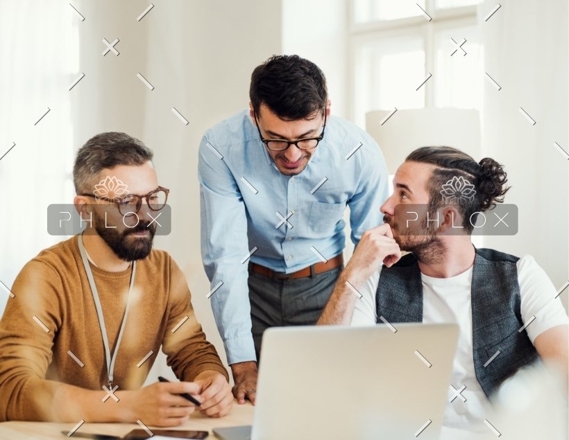 demo-attachment-586-group-of-young-businesspeople-with-laptop-working-8SHTZUN